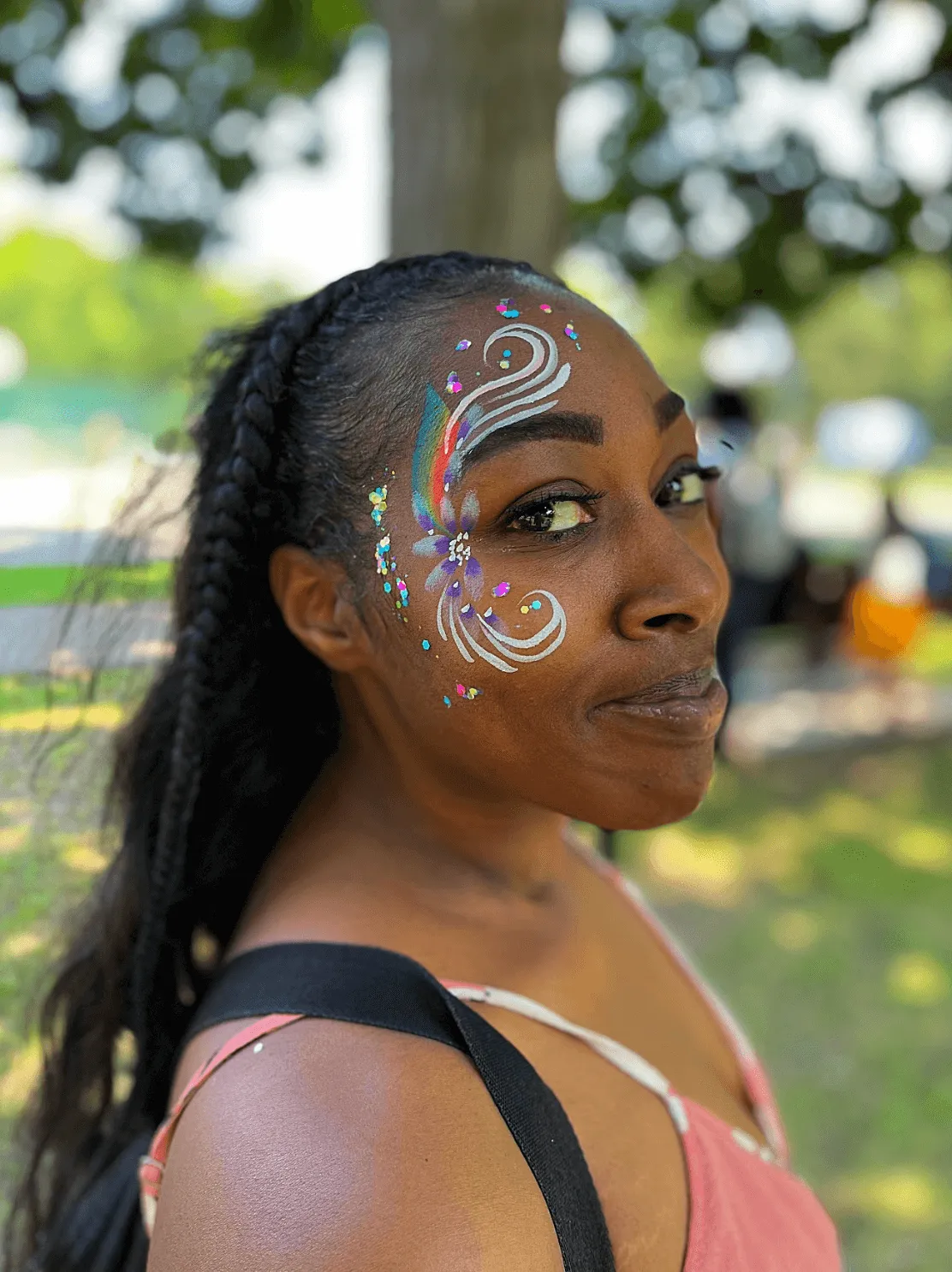 A beautiful face adorned by intricate glitter art