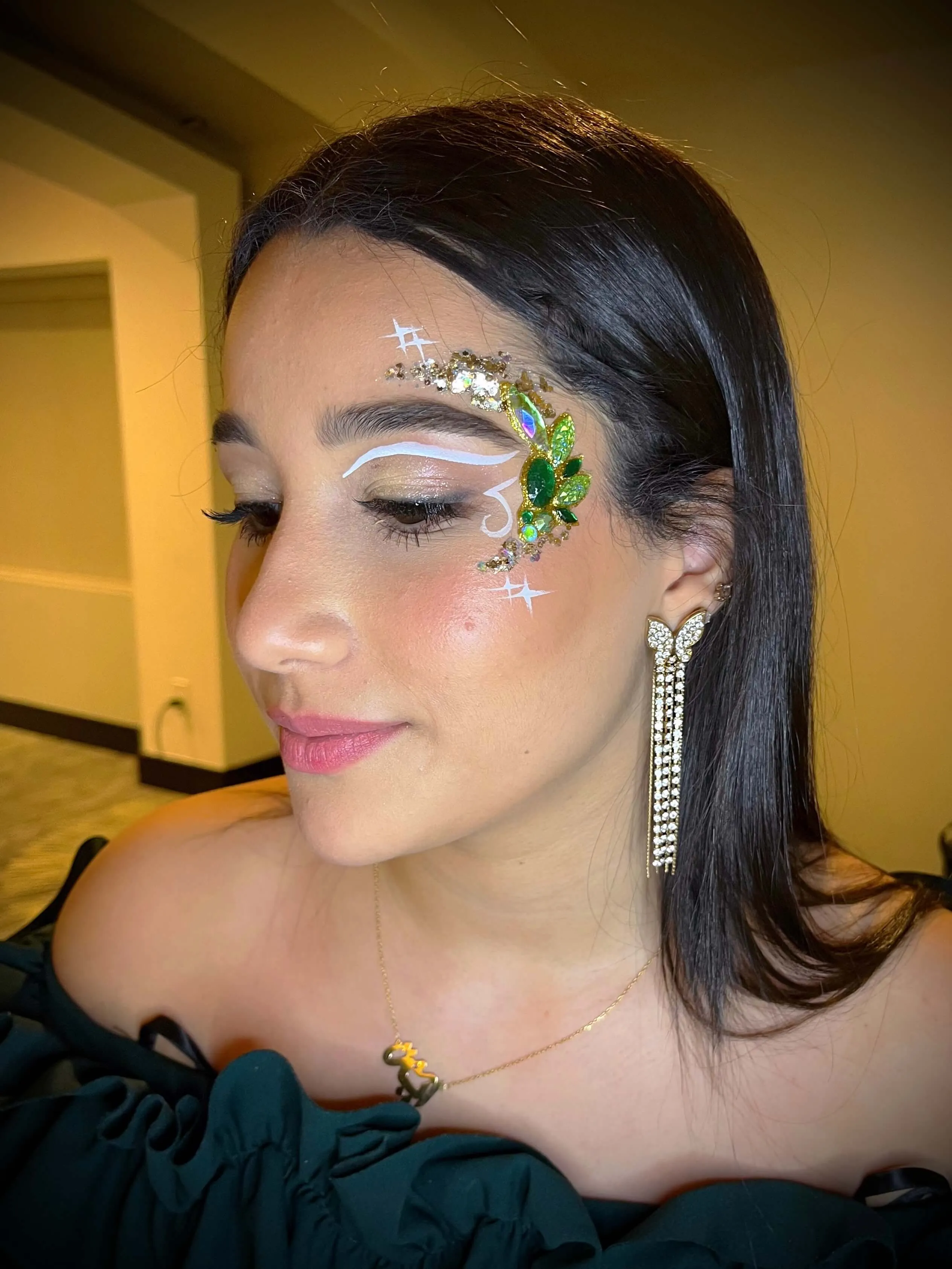 A beautiful face adorned by intricate glitter art