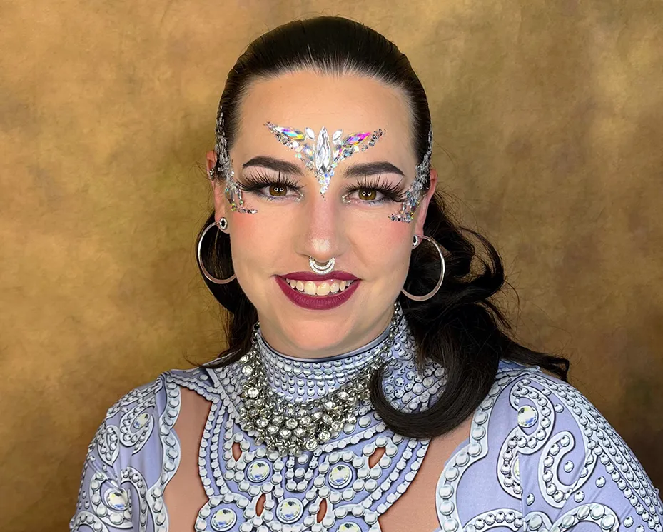 A beautiful face adorned by intricate glitter art