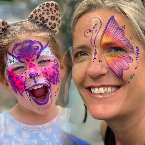 A kid and 2 women with facepainting